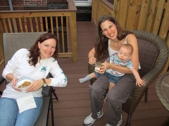 Meghan, Beth and Thomas enjoying dinner on the roof deck