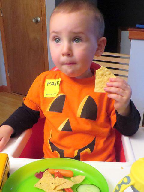 Paid for pumpkin enjoying football snacks