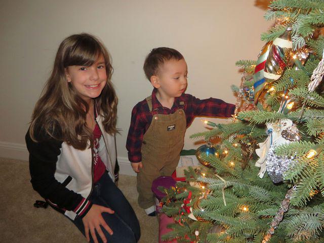 Lexi showing Thomas the ornaments