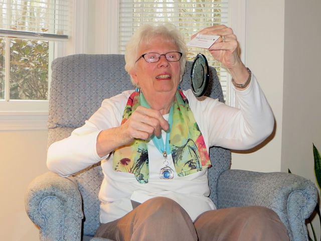 Mom admiring her Pairpoint Cape Cod Suncatcher