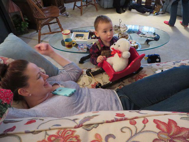 Showing Auntie Meghan the bear in the sled