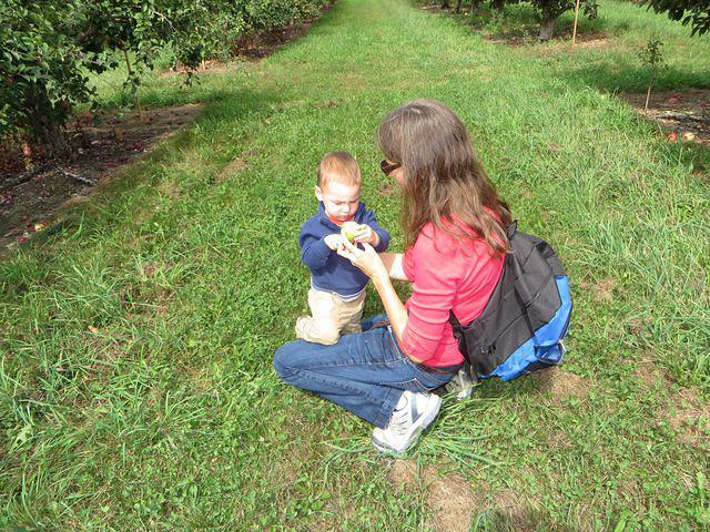 Showing his apple to Mommy