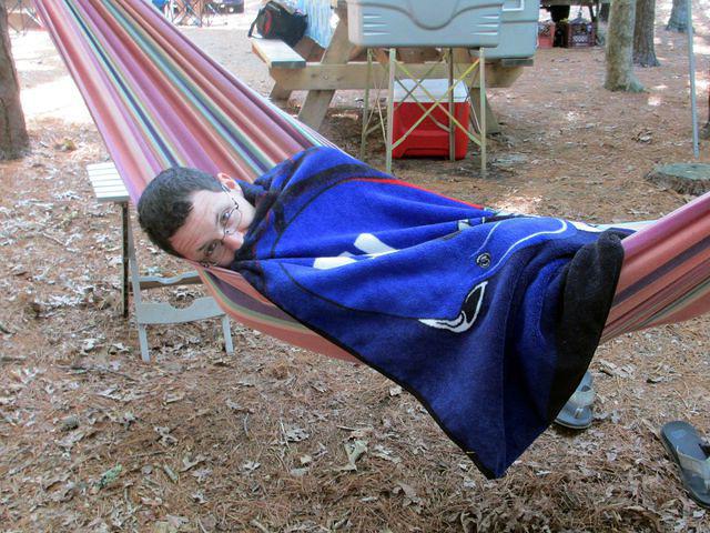 Sean snuggling in hammock on a cool morning