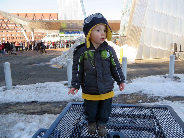 Checking out the situation while Grandpa waits in a very long line!