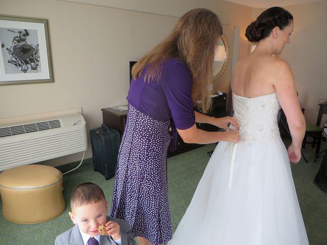 Thomas snacking behind the big white dress