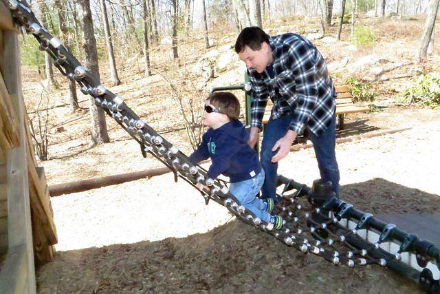 Carefully Cimbing Up the rope Ladder