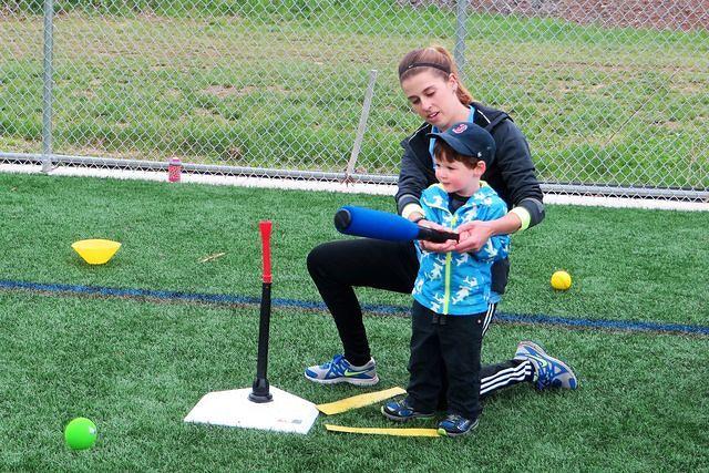Coach Ellie Helping With His Form