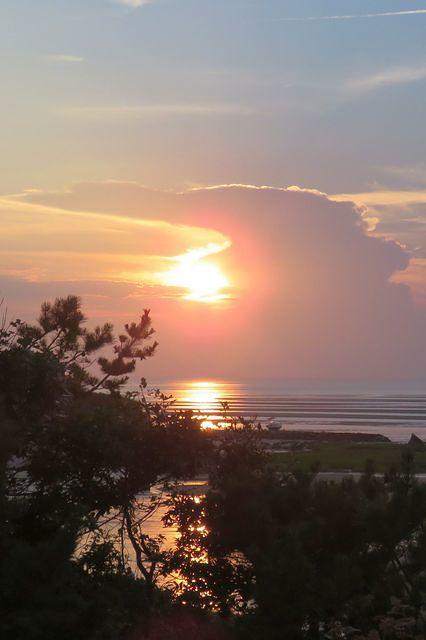 Peeking From Behind the Clouds