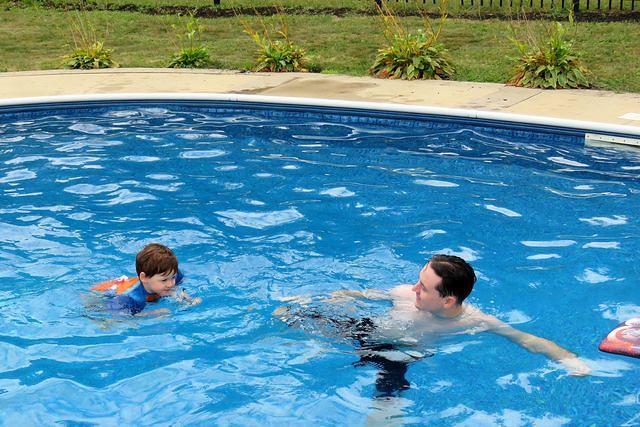 Isaac Swimming With His Muscles