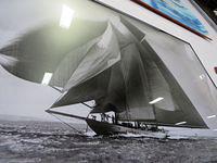 Ignore the lights reflections and check out the amount of sail!