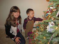 Lexi showing Thomas the ornaments