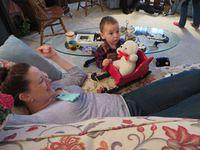 Showing Auntie Meghan the bear in the sled