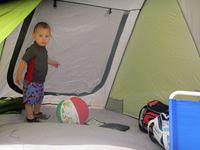 Thomas hiding in the beach tent