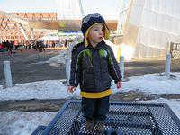Checking out the situation while Grandpa waits in a very long line!
