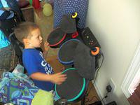 Singing and Drumming to Dirty Deeds Done Dirt Cheap by AC/DC