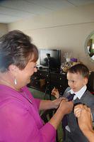Grandma Fixing Little Mans Tie