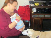 Dusty checking out the little guy