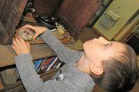 Carefully Arranging His Items