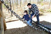 Carefully Cimbing Up the rope Ladder