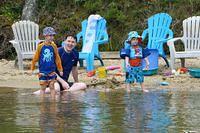 Watching the Ducks Cruise Under the Dock