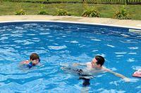 Isaac Swimming With His Muscles